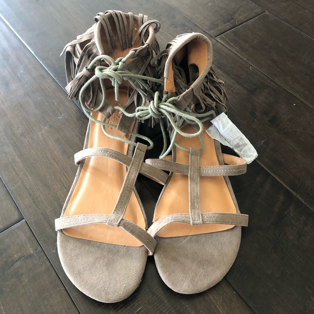 Fringe sandal with 1/2” heel